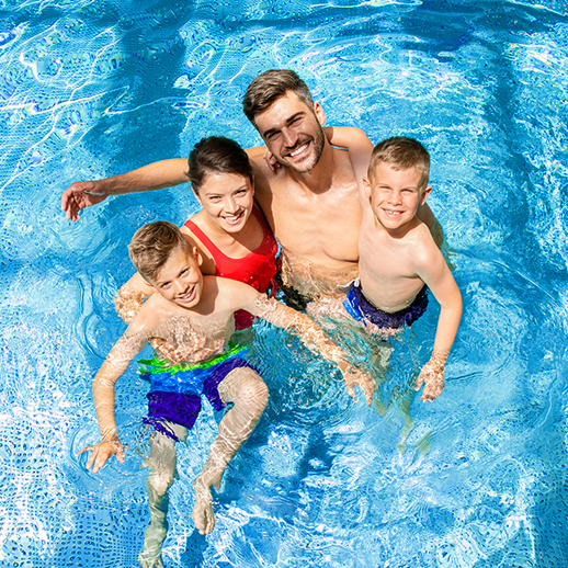 Family enjoying a swimming pool
